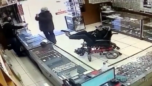 bizarre-robbery-involve-disabled-guy-wheelchair-handle-gun-feet-cctv.jpg